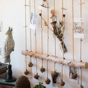 Natural birch wood photo wall hanging with hemp ropes and pine cones for home decor