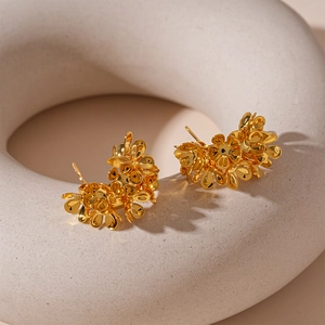 Elegant gold flower cluster C-shaped stud earrings with a refined metallic finish