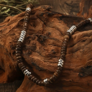 Bohemian retro wood bead necklace with turquoise and silver accents on wood
