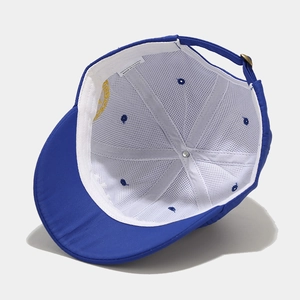 Detail view of the breathable mesh lining and adjustable metal buckle on blue baseball cap