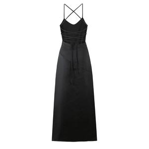 Detail of elegant black satin evening dress showing the open back and crisscross tie-up straps