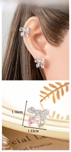 Detail shot of silver bow earrings with zircon stones and crystal pendant dimensions