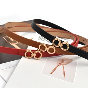 Fashionable slim PU leather belts for women in black, brown, and red with gold buckles