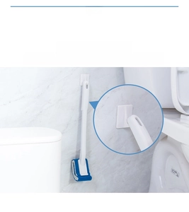 Detail view of the long handle toilet brush hanging on the wall with the adhesive hook