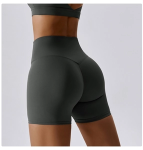 Macro detail of high-waist fitness shorts featuring V-shape contouring and lifting seams