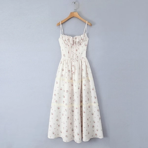 Detail of floral spaghetti strap dress with lace patchwork and drawstring bust