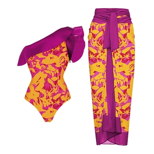 Detail view of one-shoulder floral swimwear set with ruffle trim and matching sarong