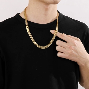 Polished gold foxtail chain necklace for men made of durable stainless steel on male model