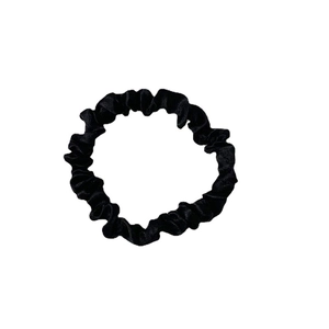 Elegant black satin scrunchie with soft silk texture on a clean white background