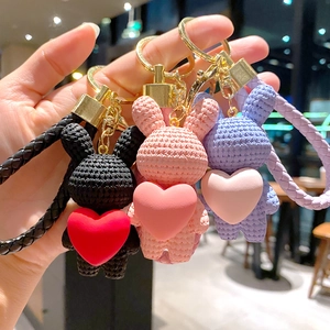 Cute hand-woven rabbit keychain with heart pendant, creative car key ring and bag charm