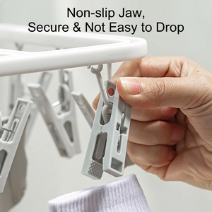 Foldable laundry drying rack with non-slip clips for socks and underwear on balcony