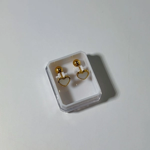 Detail of 18k gold heart stud earring with shell inlay and ball back screw on white base
