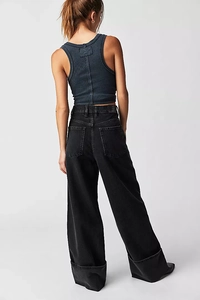 Rear view of washed black wide-leg jeans paired with a grey ribbed racerback tank top