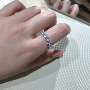 Detailed view of S925 sterling silver ring featuring heart-cut cubic zirconia stones