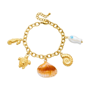 Gold-plated ocean theme charm bracelet with sea horse turtle shell and nautilus charms