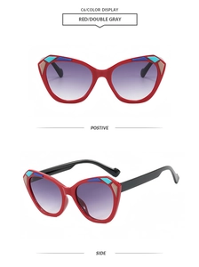 Close-up of cat-eye sunglasses with bold red frames and stylish color-blocked accents