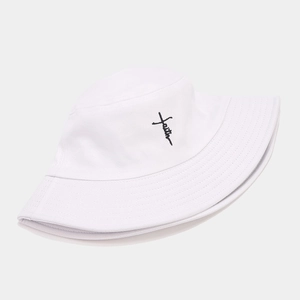 Detail of white cotton bucket hat featuring black faith and cross embroidery decoration