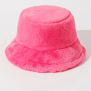 Close-up detail of soft fuzzy texture on pink plush winter bucket hat for women