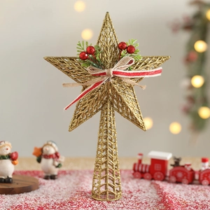 Golden hollow iron Christmas tree topper star with red berries and striped ribbon bow