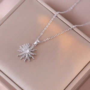 Elegant rotating bauhinia flower necklace in silver finish with sparkling zircon pendant