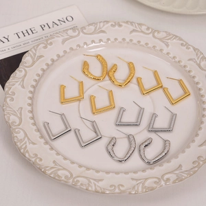 Textured 18K gold and silver plated titanium steel geometric earrings set on vintage plate