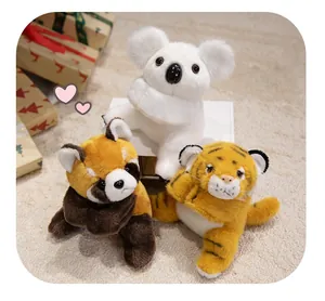 Detail of plush animal slap bracelets including koala, panda and tiger on soft rug