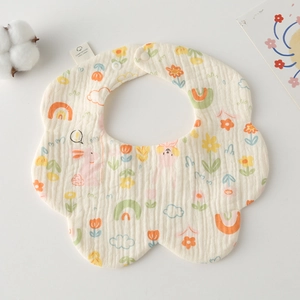 Detailed view of petal-shaped cotton baby bib featuring cartoon rabbits and rainbows