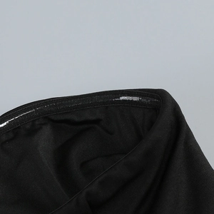 Detail of internal non-slip silicone strip on black mesh off-shoulder evening dress