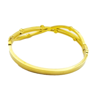 Luxe gold stainless steel crisscross bangle with crystal accents for women