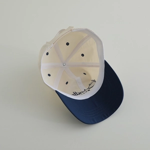 Detail view of quick-dry kids baseball cap showing inner stitching and contrast color brim
