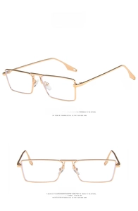 Detail of square gold metal frame sunglasses with elegant hollowed temples on white background