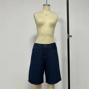 Detailed front view of dark blue denim shorts with five pockets and contrast stitching