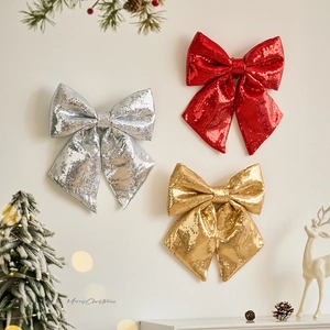 Glittery Christmas bows in red gold and silver for festive tree decoration and display