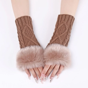 Close-up of brown knitted fingerless gloves with soft faux fox fur trim for winter