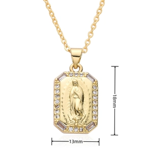 Detailed view of gold Virgin Mary pendant measuring 18mm by 13mm with inset stones
