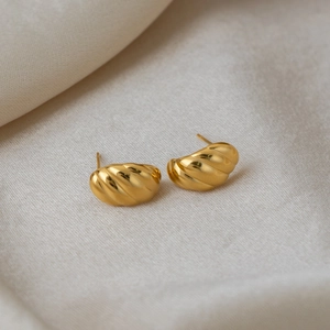 Polished 18K gold-plated stainless steel striped C-shaped stud earrings on silk