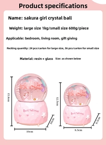 Size comparison of Sakura Girl crystal snow globe in small and large resin glass models
