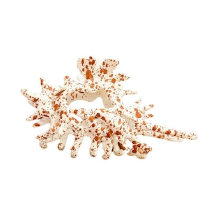 Oversized coral-shaped hair claw clip in creamy white with reddish-brown speckles