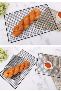 Rectangle black non-stick cooling rack for bread on elegant marble background