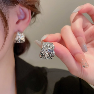 Chic irregular crumpled silver C-shaped stud earrings featuring a textured metallic finish