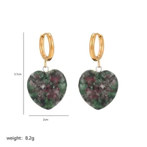 Detailed view of heart-shaped natural stone earrings with gold hoops and dimensions
