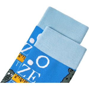 Detailed close-up of blue knit sock featuring white ONE SIZE lettering and ruler pattern