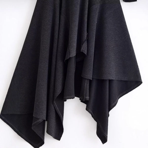 Women's black asymmetrical dress featuring thick knit fabric and a stylish irregular hemline
