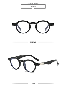Detail view showing black vintage round sunglasses frame with silver metal hinges