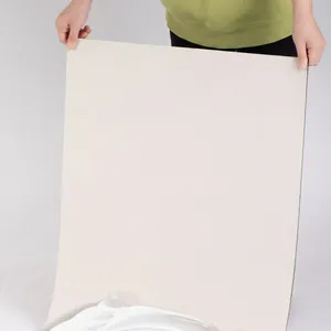 Absorbent diatom mud bath mat with non-slip rubber backing showing flexible soft material