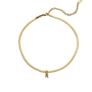 Detail of gold snake chain necklace featuring a sparkling crystal encrusted letter R pendant