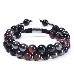 Detail of double-layer tiger eye stone bracelet with adjustable black braided cord