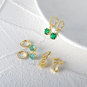 Close-up of S925 sterling silver hoop earrings with luxury crystal square pendants