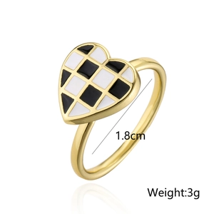 18K gold plated heart ring featuring black and white checkered enamel and open design