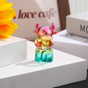 Macro view of crystal bull figurine with vibrant rainbow gradient colors on a white step